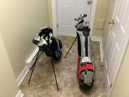 2 sets of John Daly Left Golf Cubs with bag, carts - Photo 1 of 3