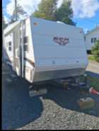 with kitchen, fridge, bathroom with shower, two beds ...