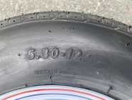 5.30 -12 4 bolt Trailer Tire Assembly - Photo 1 of 3