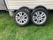 four on Saturn aluminum rims, with centers, price is ...