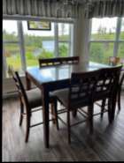 solid wood table with 6 padded chairs, table measures ...