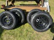 four Goodyear Ultra Grip Winter Tires on Steel Rims, ...