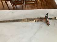 with a Bull horn handle, it is NOT a sword, it is a ...