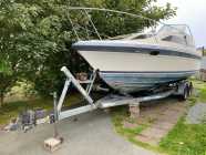 Boat and EZ Loader trailer for sale.
