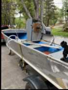 Boat motor and trailer  - Photo 1 of 4