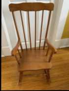 Child’s wooden rocking chair.