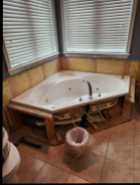 Corner Whirlpool Tub with Roman Faucet $300