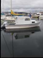 For  Sale. 22 foot boat with cabin, galvanized tandem ...