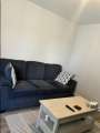 Grey sofa with pillows  - Photo 1 of 2