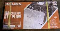 A Kolpin Switchblade ATV Snow Plow System