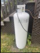 Propane tank, 100lb and propane