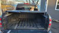 Roll up truck bed cover