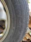 All season tires on rims  - Photo 2 of 3