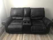 Selling power reclining love seat.