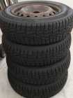 Set of 4 steel rims and tires.  Size 175/70R-14