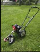 Southland Weed Trimmer on wheels - Photo 1 of 2