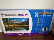 Westinghouse 4K UHD 58" Edgeless Roku Smart TV - Photo 1 of 4