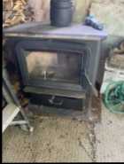 Woodstove for sale with chimney in excellent condi