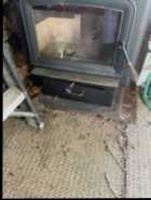 Woodstove for sale with chimney in excellent condi - Photo 1 of 7